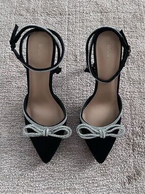 BCBG Black Pointed Toe Ankle-Strap Heels with Crystal Bow